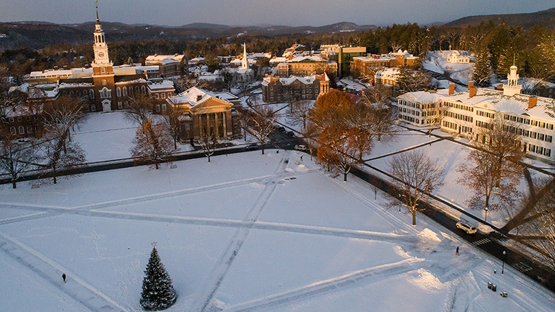 aerial photo of the Dartmouth Green covered in snow with a Christmas tree